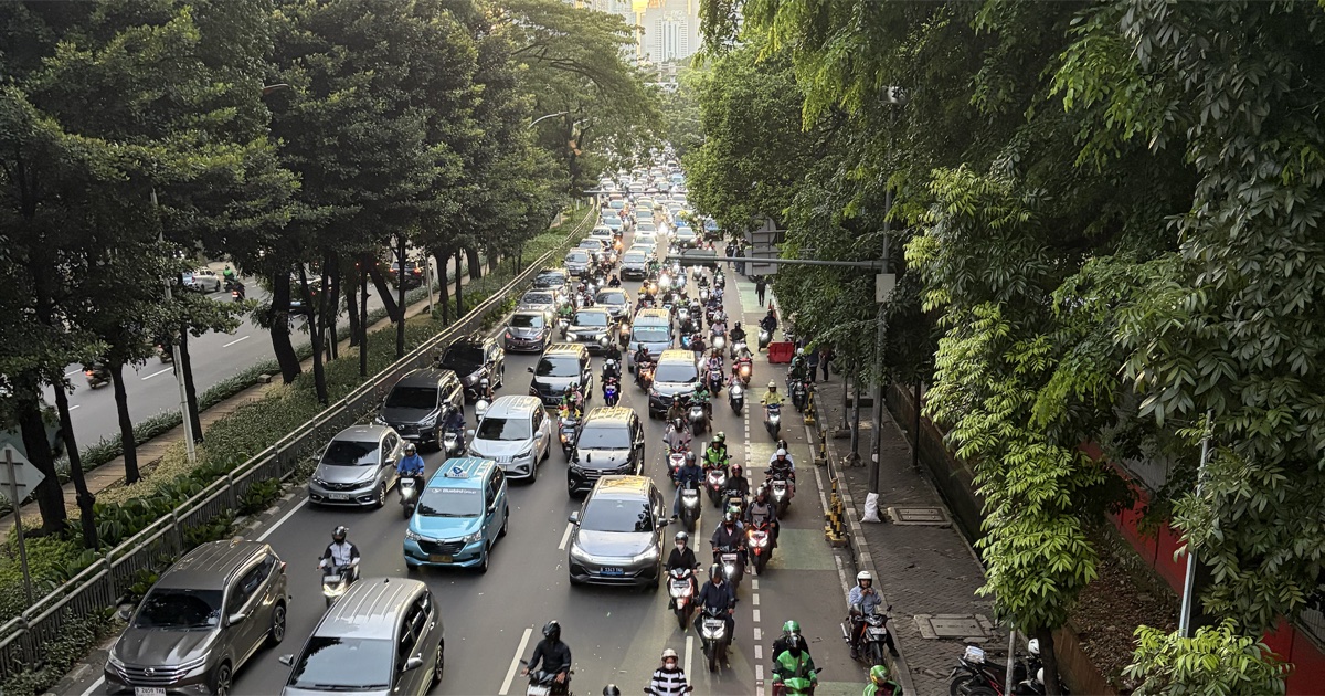 Jakarta rush hour traffic with Grab and Gojek motorcycle riders